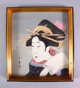 A JAPANESE WOODBLOCK PRINT OF A KABUKI ACTOR - KITAGAWA UTAMARO - depicting a posed kabuki actor