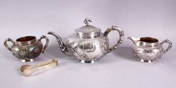 A VERY GOOD CHINESE THREE PIECE SILVER TEA SET, decorated with prunus and birds in relief, with