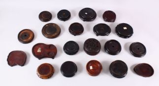 A MIXED LOT OF 20 CHINESE CARVED HARDWOOD STANDS - each of varying size, shape, style and timber,