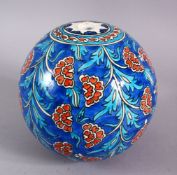 A KUTAHYA GLAZED POTTERY HANGING ORNAMENT, With floral motif decoration, 16cm