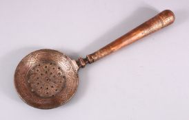 AN 18TH / 19TH CENTURY PERISAN COPPER LADLE / STRAINER, with calligraphic band decoration, 38cm