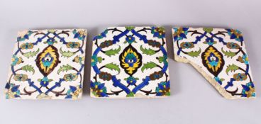 A SET OF THREE EARLY SAFAVID POTTERY TILES, each with the same decoration, white ground ith blue