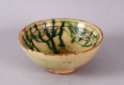 A 13TH CENTURY SMALL SCRAFFITO POTTERY BOWL, with carved borders and green splash, 9cm.
