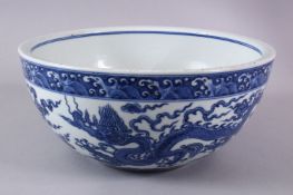 A CHINESE MING STYLE BLUE & WHITE PORCELAIN DRAGON BOWL - The body decorated with a dragon and cloud
