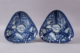 A PAIR OF JAPANESE ARITA BLUE & WHITE PLATES, decorated with a central crane with lotus and crane