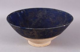 A 13TH CENTURY DEEP BLUE GALZED IRANIAN POTTERY BOWL, 19CM