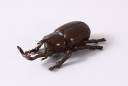A JAPANESE BRONZE FIGURE OF A LONG MOUTH BEETLE - the base with a seal mark, 7cm
