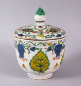 A EARLY 19TH CENTURY TURKISH OTTOMAN KUTHAYA POTTERY BOWL & COVER, with a white ground with floral