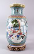 A GOOD CHINESE REPUBLIC FAMILLE ROSE PORCELAIN LANTERN VASE & STAND, decorated with to larger panels