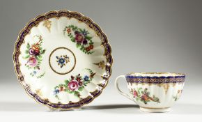A WORCESTER TEACUP AND SAUCER painted with the Royal Marriage pattern, so-called after a service
