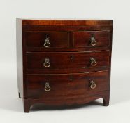 AN APPRENTICE GEORGIAN MAHOGANY BOWFRONT CHEST with beaded top, 2 short and 2 long with brass