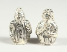 A PAIR OF .800 PUNCH AND JUDY SALT AND PEPPERS
