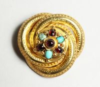 A VICTORIAN GOLD BROOCH set with opal and amethyst.