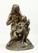 A GOOD 19TH CENTURY BRONZE GROUP a man teaching a young boy to play a mandolin. 16ins high.