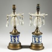 A GOOD PAIR OF WEDGWOOD BLUE AND WHITE LUSTRES with prism drops 11ins higH.