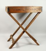A PINE TRAY WITH FOLDING STAND, 'MOET CHANDON' TRAY. 2ft 1.5ins long