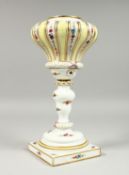A MEISSEN PORCELAIN LAMP BASE painted and sprigged with flowers on a square base. Cross swords