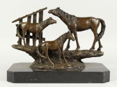 MILO - A GOOD BRONZE OF THREE HORSES on a marble base. Signed, 15ins long