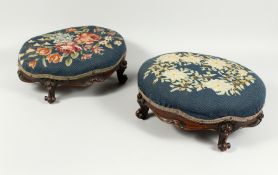 A GOOD PAIR OF VICTORIAN MAHOGANY OVAL FOOT STOOLS with needlework tops on cabriole legs. 14ins