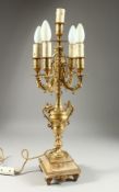 A 19TH CENTURY ONYX AND GILT METAL FIVE LIGHT CANDLELABRA on a square stepped base.