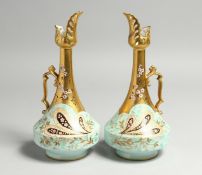 A GOOD PAIR OF M. REDON, LIMOGES, TALL BULBOUS JUGS, gilt and scroll decoration with flowers.