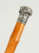 A VICTORIAN BLACKTHORN WALKING STICK with cast metal bull dog handle. 38ins long.