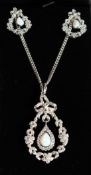 A SILVER OPAL PENDANT AND CHAIN AND EAR RINGS