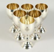 A SET OF SIX SILVER GOBLETS, 6 ins high with crest, Crown XCIV. London Weighs 28oz