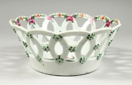 A WORCESTER BASKET, the centre painted with a large bouquet and the border painted with cabbage