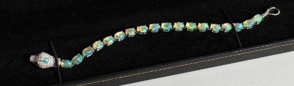 A SILVER OPAL SNAKE'S HEAD LINE BRACELET
