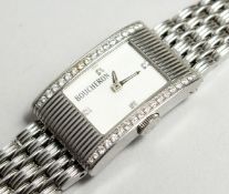 A GOOD DIAMOND SET BOUCHERON WATCH No. 090-3067 in original pouch