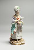 A GOOD 19TH CENTURY MEISSEN PORCELAIN FIGURE OF A LADY with muff, reading a book. Cross swords