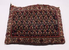 A PERSIAN CUSHION 2ft 6ins x 1ft 6ins