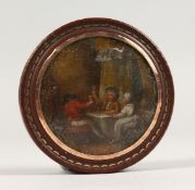 A 19TH CENTURY TORTOISESHELL CIRCULAR BOX, the lid painted with a tavern scene. 3ins diameter.