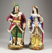 A LARGE PAIR OF PARIS PORCELAIN FIGURES OF A TURKISH MAN holding a sword and a young lady. 16ins
