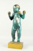 AN ABSTRACT BRONZE BROKEN STANDING BABY on a gilt metal base. 24ins high