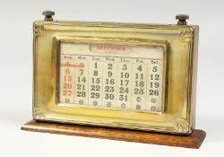 A DESK CALENDER 7.5ins long