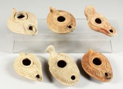 SIX VARIOUS ROMAN POTTERY LAMPS