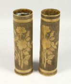 TRENCH ART, A GOOD PAIR OF BRASS SHELL CASES engraved with flowers. 11.5ins hgih