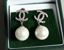 A PAIR OF CHANEL STYLE PEARL DROP EAR RINGS