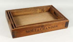A GRADUATED SET OF THREE PINE TRAYS 'VEUVE CLICQUOT', largest tray 1ft 10ins long
