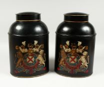 A PAIR OF OVAL TOLEWARE BINS and lids with coat of arms. 13ins high