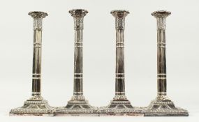 A SET OF FOUR CLUSTER COLUMN OF CLASSIC DESIGN on square loaded bases. 13ins high