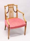 A SHERATON SATINWOOD PAINTED ARM CHAIR, with railed back, padded seat on tapering legs.