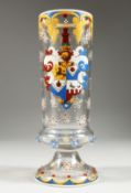 AN ARMORIAL ENAMEL GLASS. 8.5ins high.