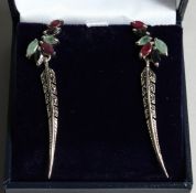 A PAIR OF SLVER, EMERALD, RUBY AND SAPPHIRE FEATHER DESIGN EAR RINGS
