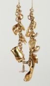 A 9CT. GOLD CHARM BRACELET