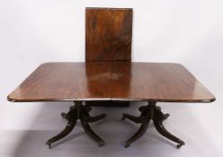 A GOOD GEORGE IV PERIOD MAHOGANY TWIN PILLAR DINING TABLE, comprising a pair of tilt top ends with