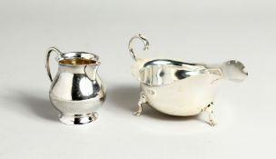 A SAUCEBOAT, Chester, 1906 and a sparrow beak jug, Birmingham 1961. (2)