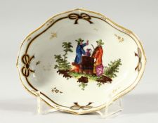 A VIENNA PORCELAIN OVAL DISH with blue and gilt ribbon and man drinking ale. Blue beehive mark